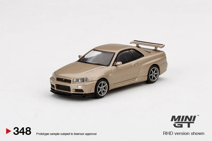 NISSAN SKYLINE GT-R (R34) M-SPEC (SILICA BREATH GOLD) MINI GT 1:64