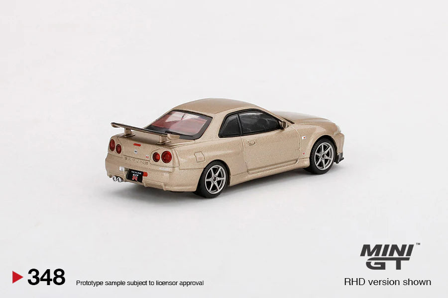 NISSAN SKYLINE GT-R (R34) M-SPEC (SILICA BREATH GOLD) MINI GT 1:64